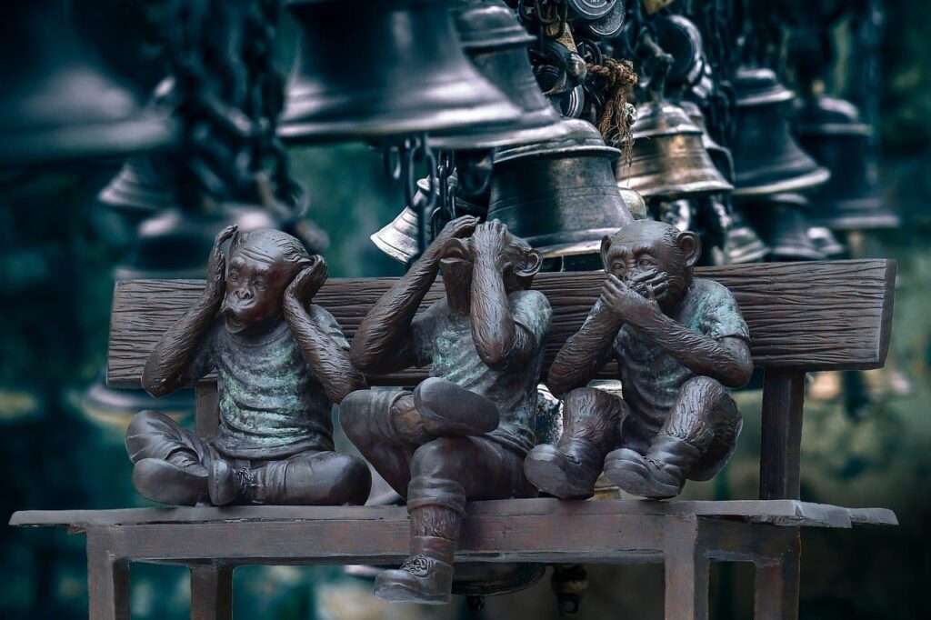 Three monkey statues