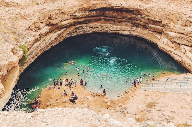 People bathing in Bimmah Sinkhole in Oman