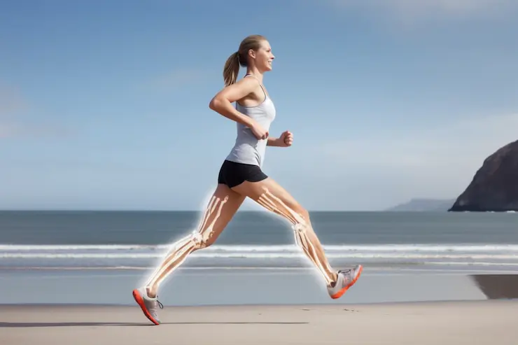 Woman running on the beach displaying strong bones